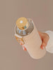 Close up of gold lid of Mismatch Beige water bottle