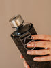 Close up of silver holder of Mismatch Silver glass water bottle by EQUA