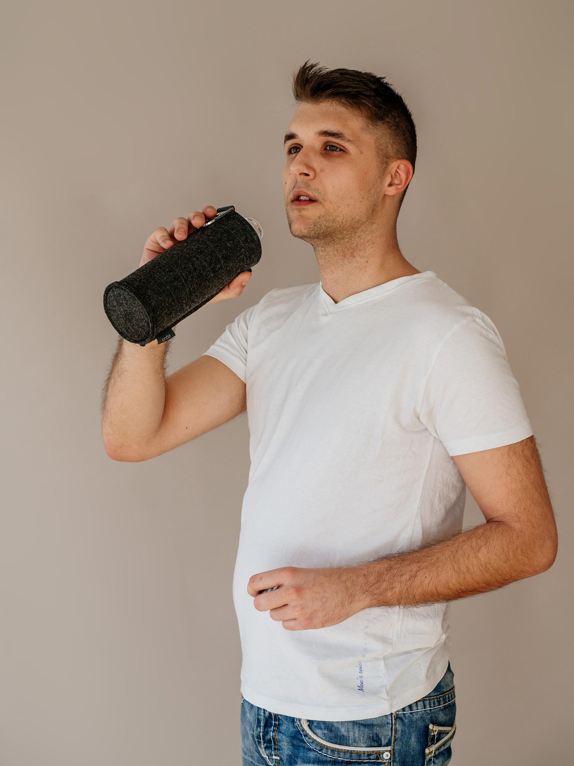 Boy holding in his right hand Mismatch Silver glass water bottle