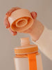 EQUA BPA FREE water bottle, Sunrise, close up of the lid and mouthpiece, peach color