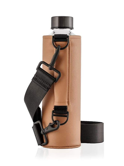 EQUA glass bottle in a brown faux leather bag with crossbody strap.