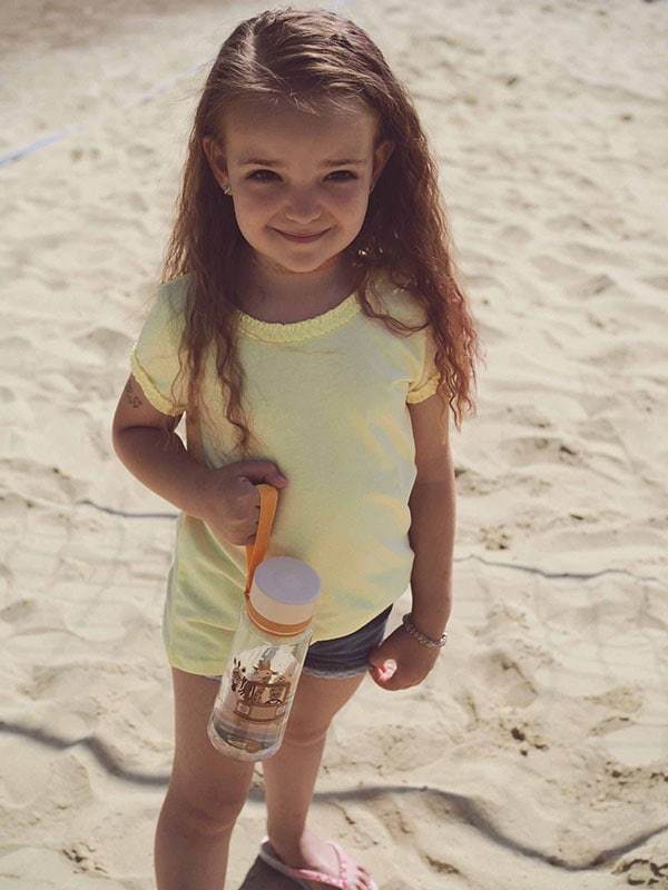EQUA BPA FREE water bottle, Safari, little girl is holding bottle in her hand, motif of animals, beige color