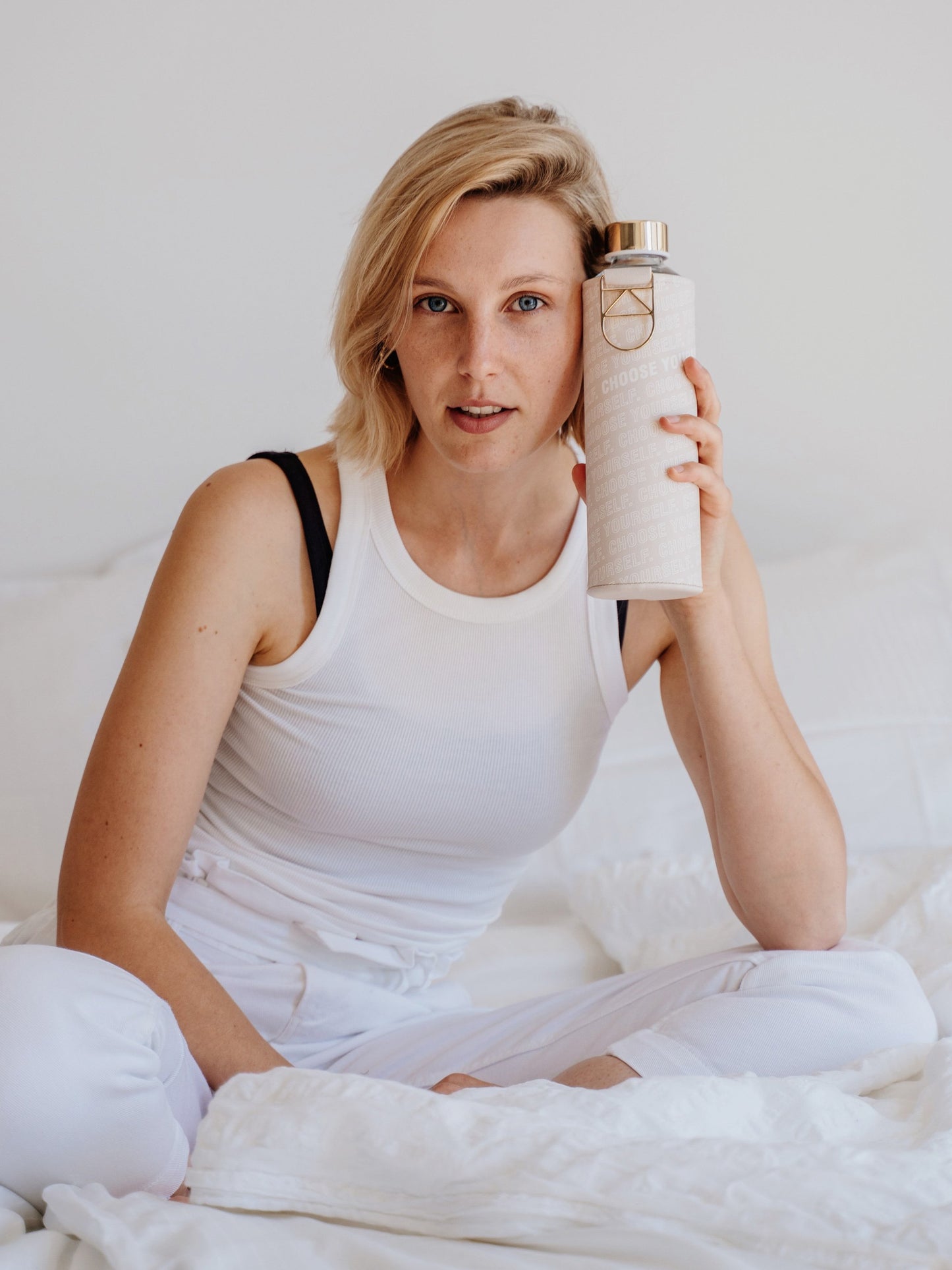 Blonde girl with Mismatch Choose Yourself glass water bottle